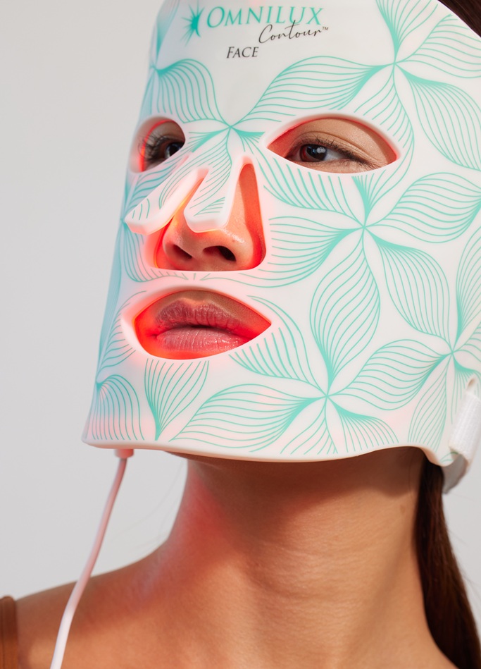 Omnilux LED Face Mask (Omnilux Contour Face) is a cutting-edge light therapy device that brings professional-grade skin rejuvenation into the comfort of your home. This mask uses medical-grade LEDs to bathe your skin in specific wavelengths of light, triggering biological processes that help make your skin clearer, firmer, and more radiant. The device itself is a flexible silicone mask (FDA-cleared for home use) equipped with 132 tiny LED bulbs, the same technology trusted by dermatologists in-clinic. By simply wearing the mask for a few minutes, you can treat your face with red and near-infrared light therapy – an evidence-based method to stimulate collagen production, increase cell turnover, and calm inflammation in the skin.
